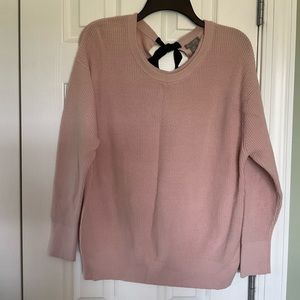 Pretty pink, tie back sweater.